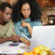 Students learning about finances on the laptop