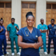 Group of african medical students posed outdoor against university door.