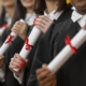people-graduating-with-diplomas-close-up