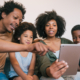 Portrait of african american family taking a selfie together with digital tablet at home. Family and lifestyle concept.